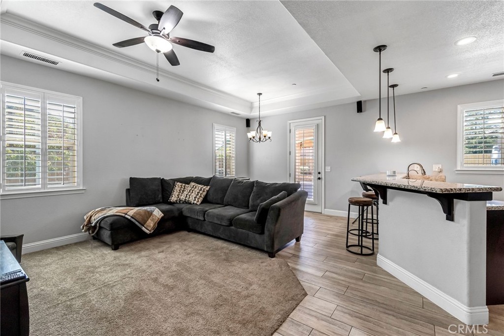 294 Double Tree Court Madera, CA 93637 - Photo 7 of 40 a living room with furniture and a wooden floor