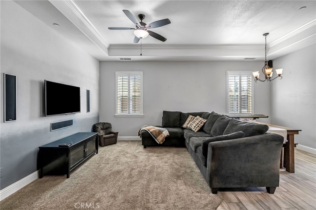 294 Double Tree Court Madera, CA 93637 - Photo 8 of 40 a living room with furniture and a flat screen tv