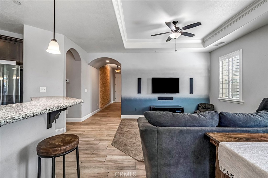 294 Double Tree Court Madera, CA 93637 - Photo 10 of 40 a living room with furniture and a flat screen tv