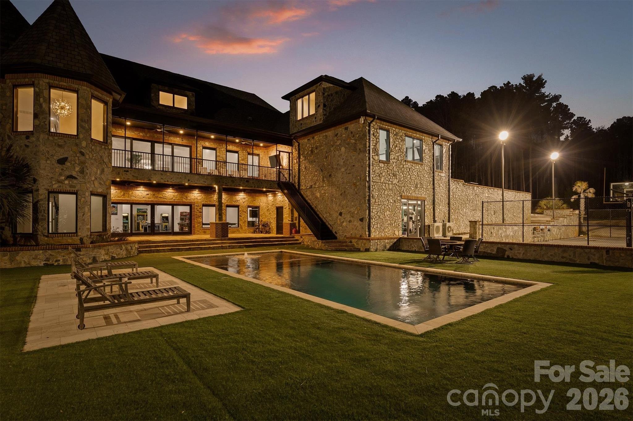 135 Stillwater Road Troutman, NC 28166 - Photo 2 of 43 a view of a house with swimming pool