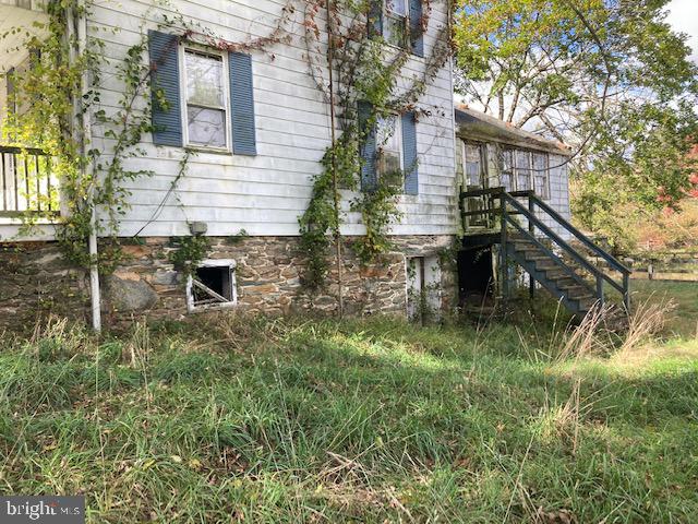 1404 Uniontown Road Westminster, MD 21158 - Photo 18 of 24 a backyard of a house with table and chairs