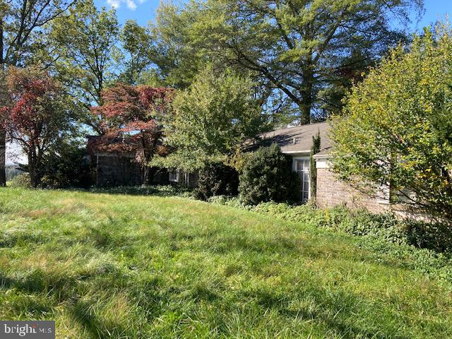 1404 Uniontown Road Westminster, MD 21158 - Photo 7 of 24 a yellow house with trees in front of it
