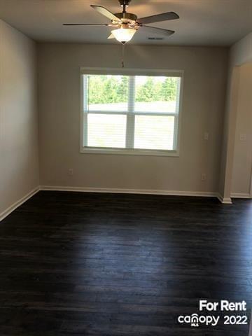 8151 Sheffield Dr. Terrell, NC 28682 - Photo 5 of 15 a view of an empty room with wooden floor and a window