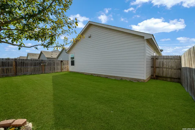 a backyard of a house with lots of green space