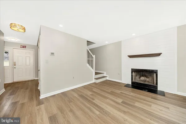 a view of a kitchen with furniture and a fireplace
