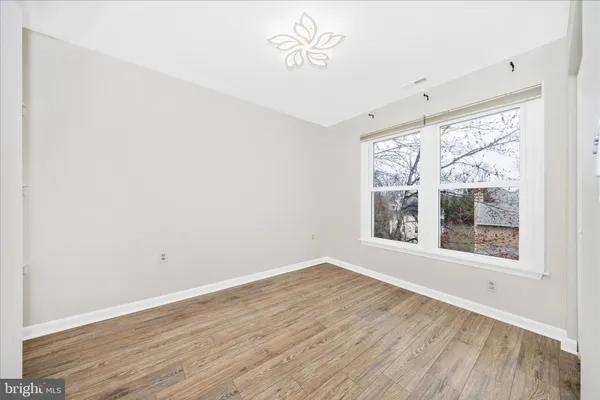 a bathroom with a sink a toilet and window