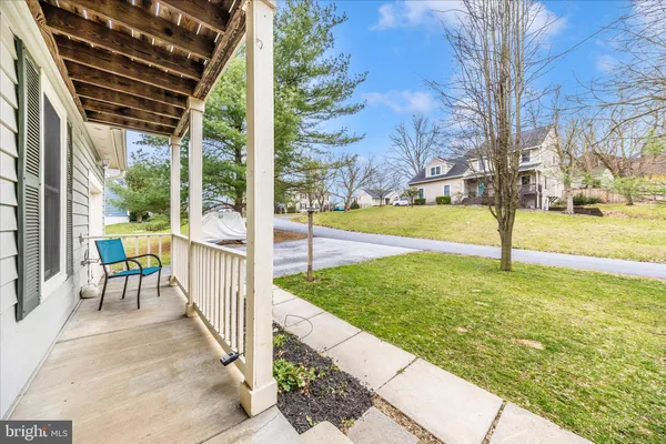 an aerial view of a house with a yard basket ball court and outdoor seating