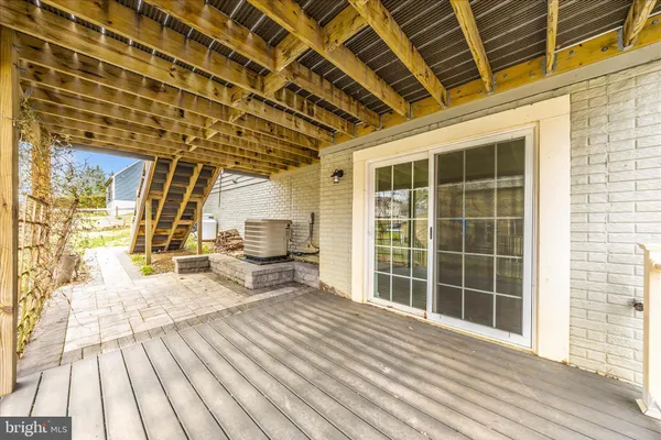 a view of a house with a yard balcony and slide
