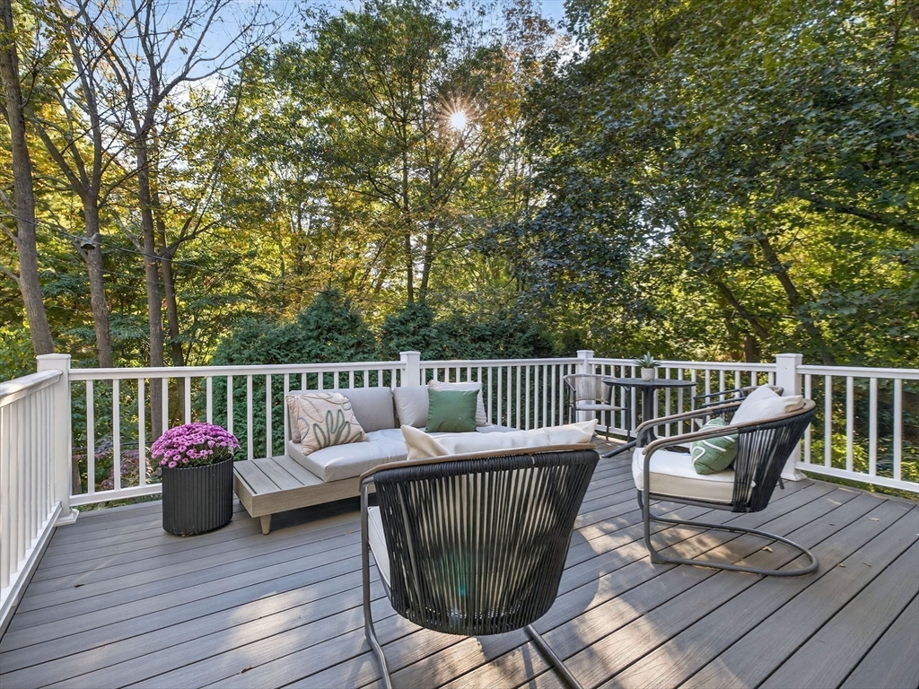 79 Peter Parley Road Boston, MA 02130 - Photo 12 of 38 a view of a deck with furniture and wooden floor