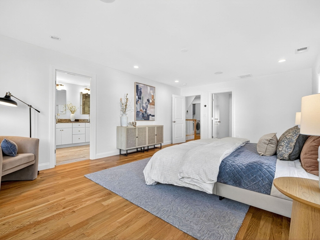 79 Peter Parley Road Boston, MA 02130 - Photo 19 of 38 a spacious bedroom with a bed and couch