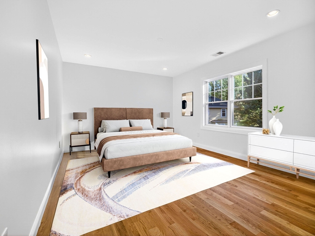 79 Peter Parley Road Boston, MA 02130 - Photo 24 of 38 a bedroom with a large bed and a large window