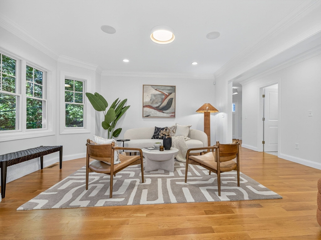 79 Peter Parley Road Boston, MA 02130 - Photo 4 of 38 a living room with fireplace furniture and a wooden floor