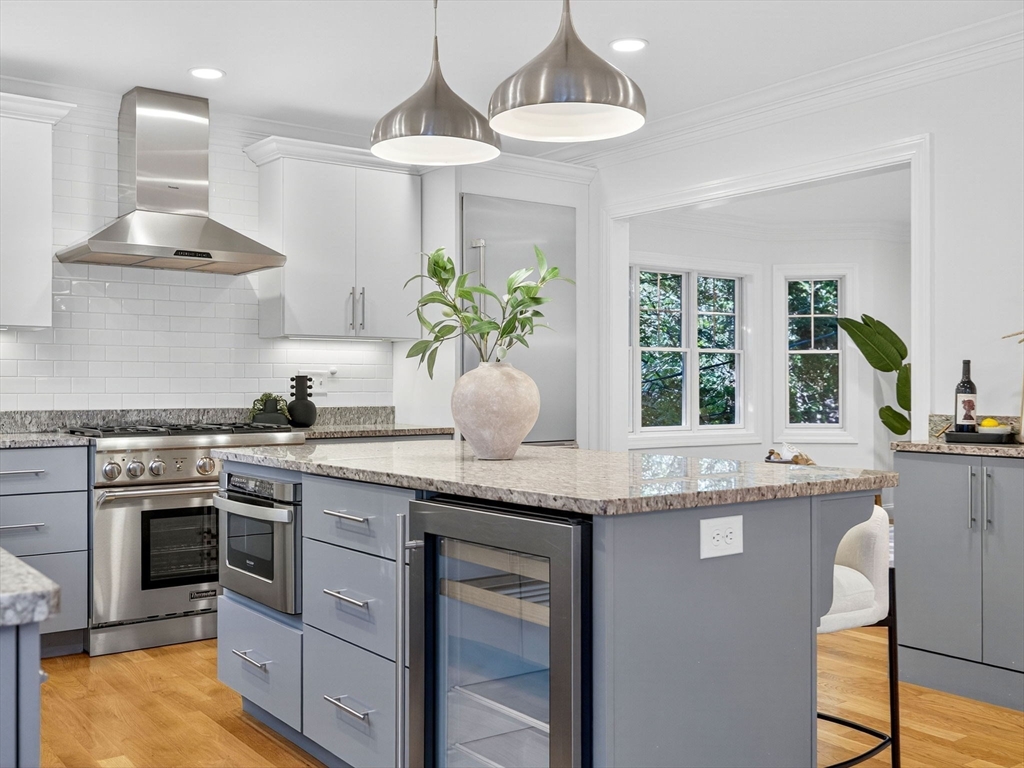 79 Peter Parley Road Boston, MA 02130 - Photo 8 of 38 a kitchen with granite countertop a sink stainless steel appliances and cabinets