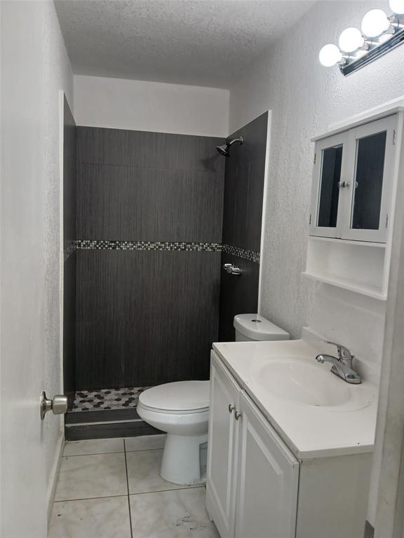 18001 Northwest 44th Avenue Miami Gardens, FL 33055 - Photo 4 of 4 a bathroom with a sink a toilet and shower