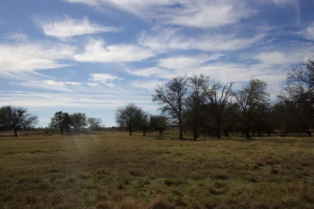 a view of lake with green valley