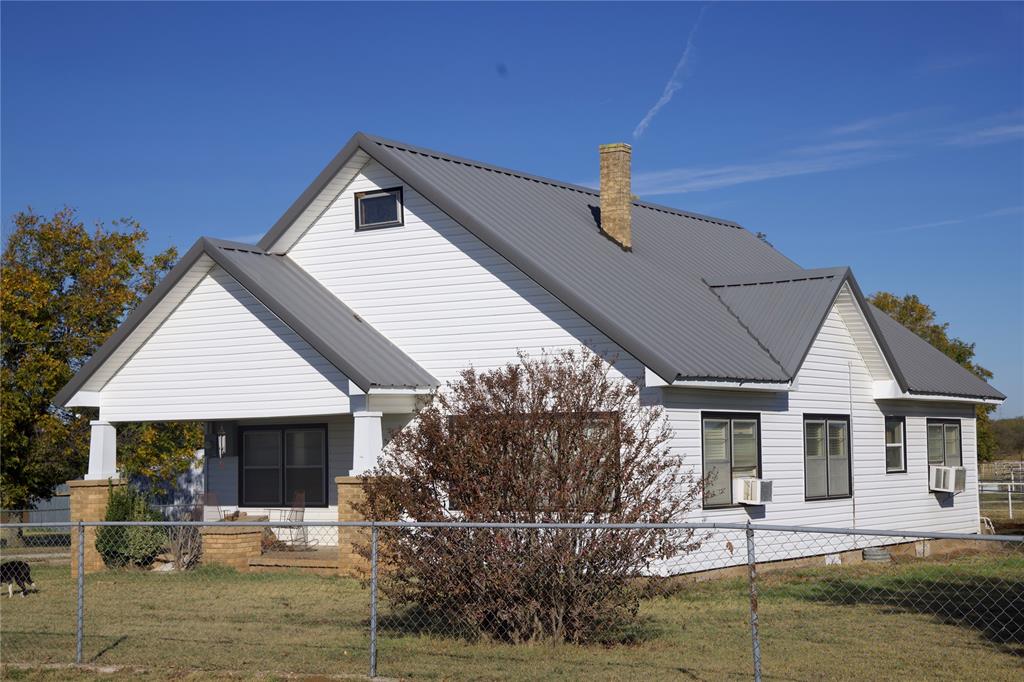 6172 Fm 1769 Graham, TX 76450 - Photo 3 of 33 a front view of a house with garden