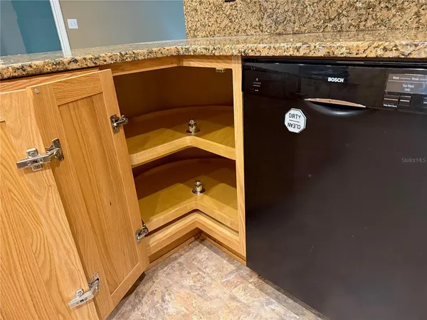 a kitchen with sink refrigerator and window
