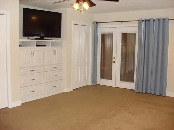 a view of a room with shelf on the wall