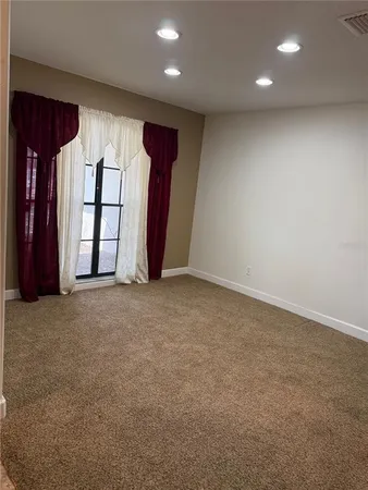 a view of house with backyard