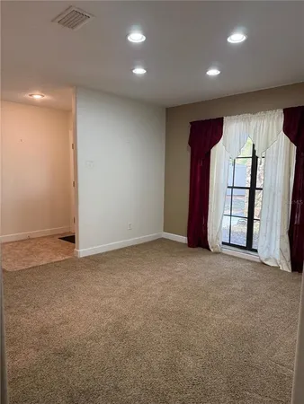 a front view of house with yard and trees