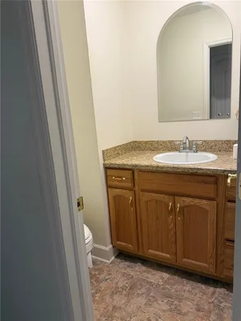 a view of a yard with plants and trees