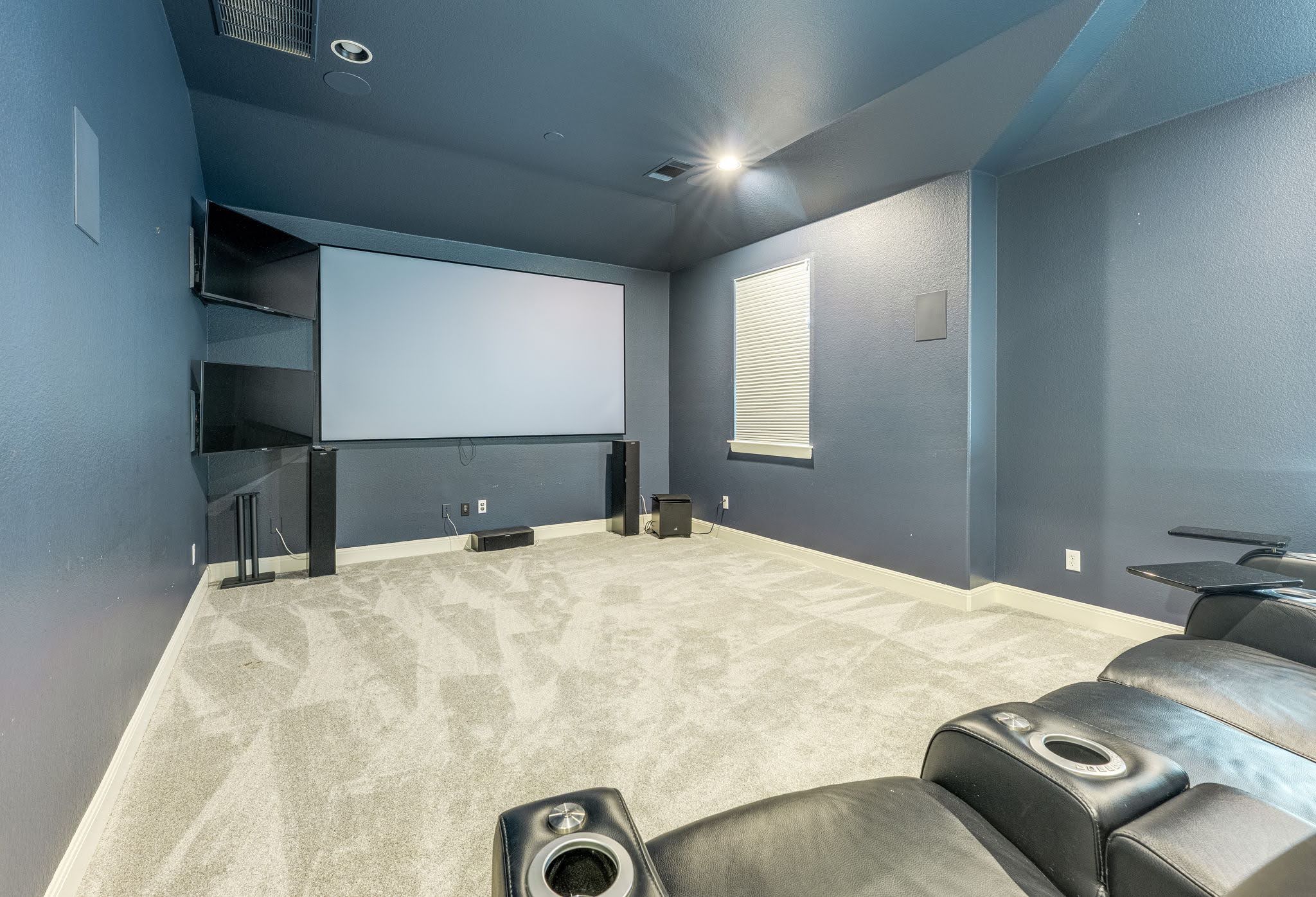 11612 Shoreview Overlook Austin, TX 78732 - Photo 33 of 40 A dedicated home theater room showcases wall-to-wall carpeting and integrated recessed lighting.