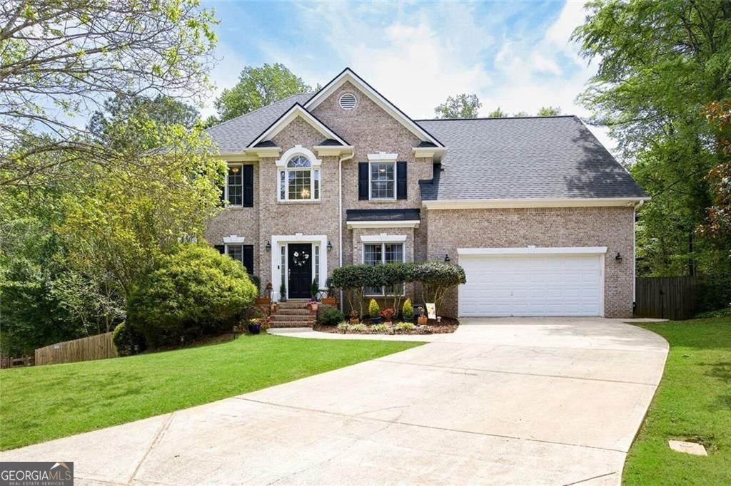 242 Hunters Crossing Dallas, GA 30157 - Photo 1 of 1 Beautiful brick-front home with inviting curb appeal and a private, wooded setting