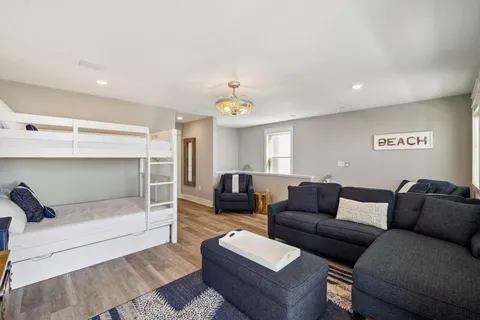 a living room with furniture and a glass door