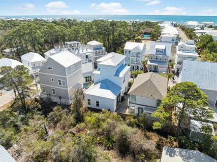 an aerial view of a house with swimming pool