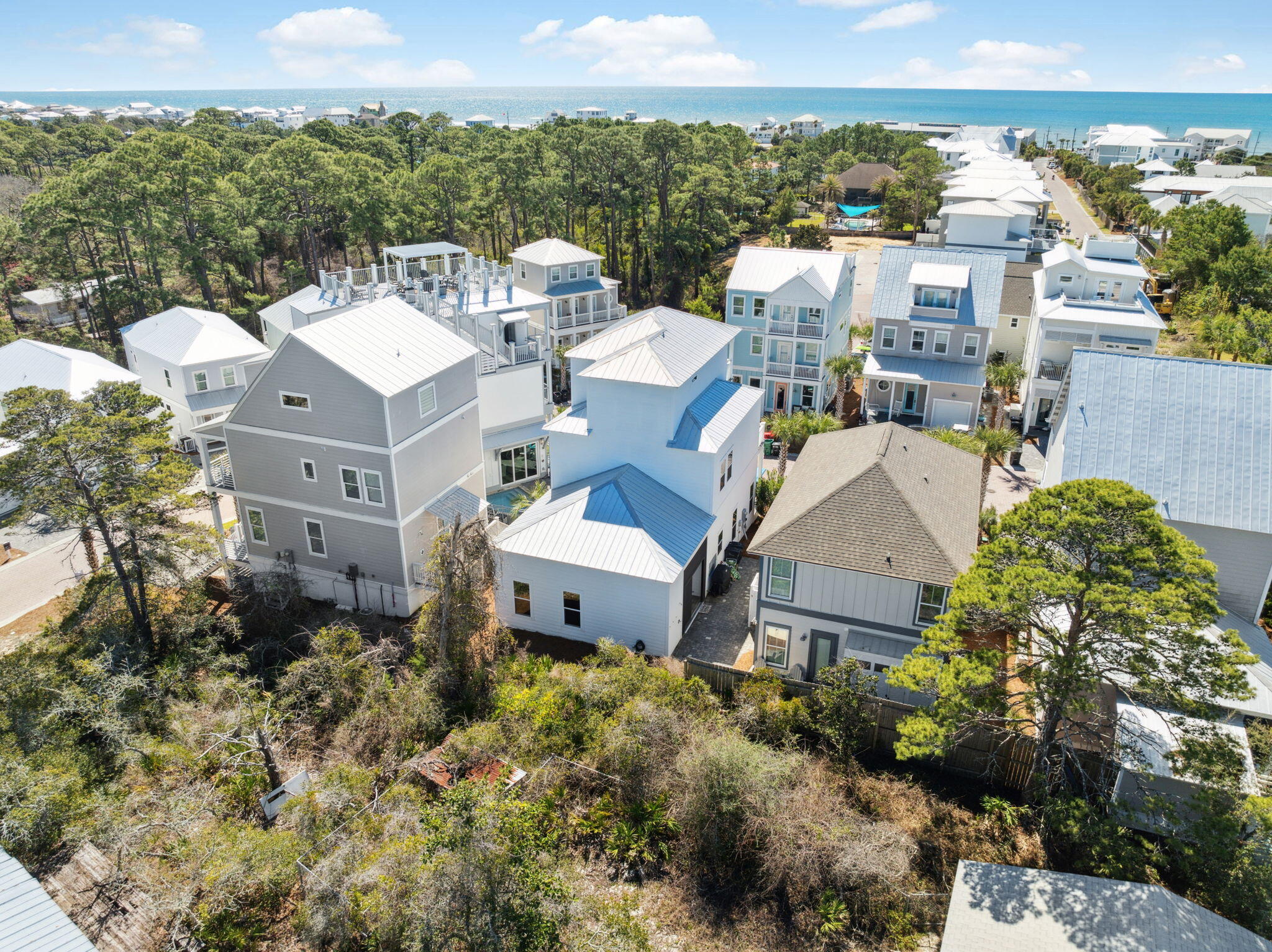 12 Clear Lane Santa Rosa Beach, FL 32459 - Photo 47 of 48 an aerial view of a house with a yard and lake view