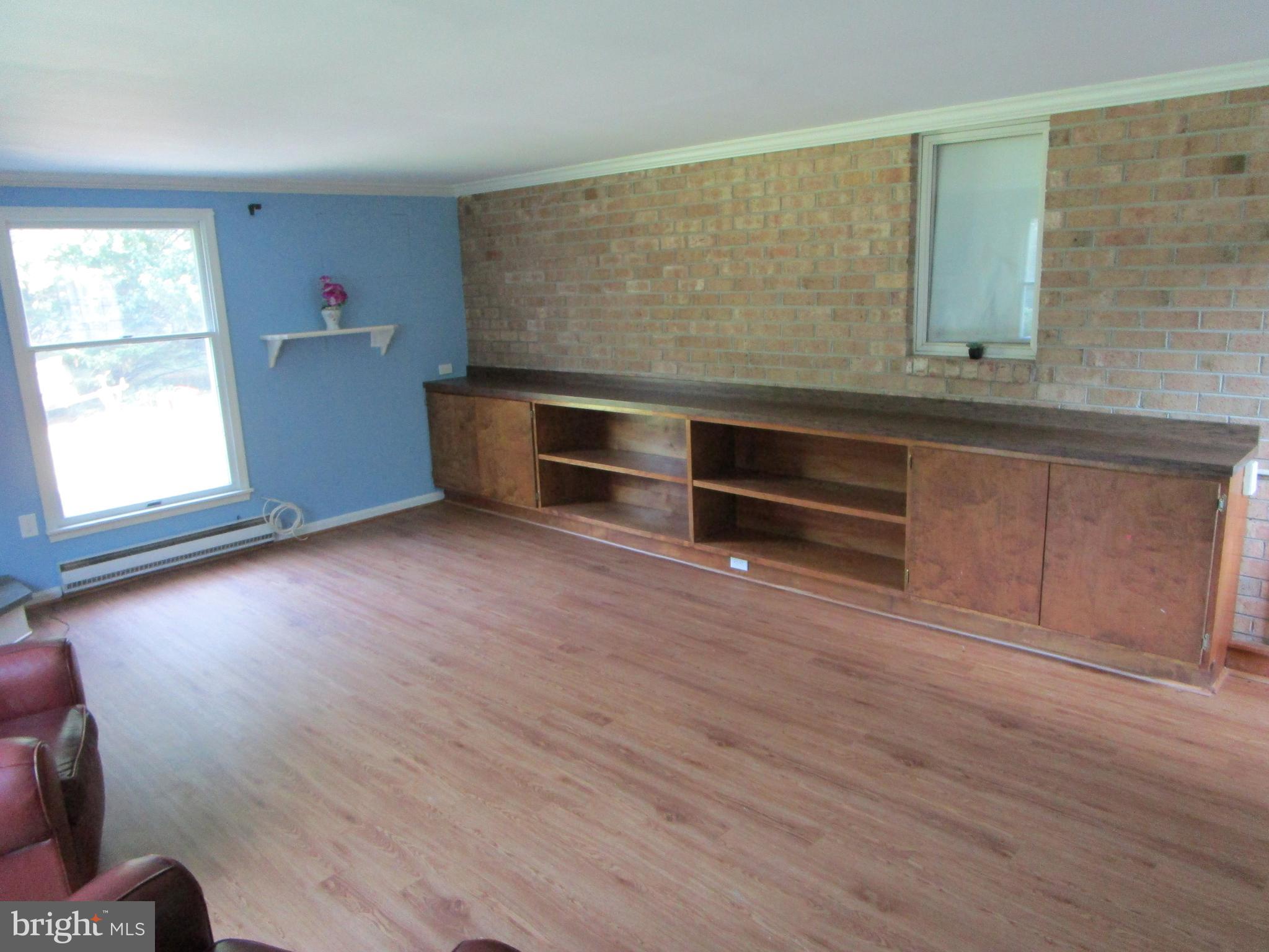 8505 Edenton Road Fulton, MD 20759 - Photo 16 of 38 an empty room with wooden floor and windows