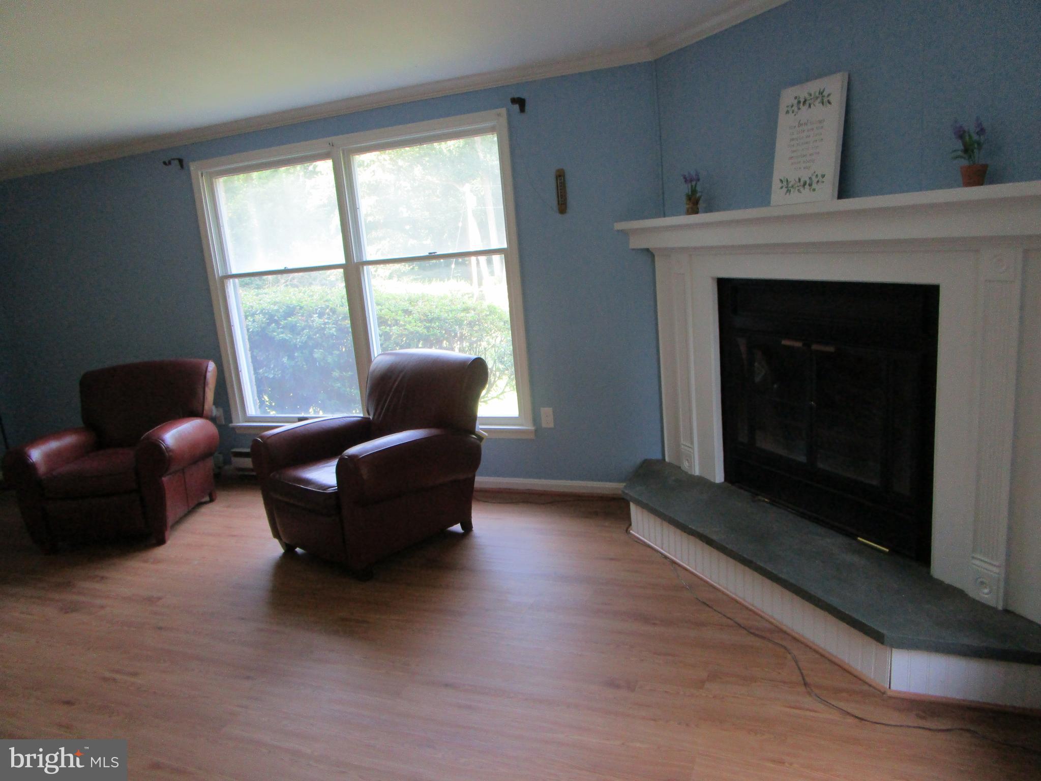 8505 Edenton Road Fulton, MD 20759 - Photo 18 of 38 a living room with furniture and a fireplace