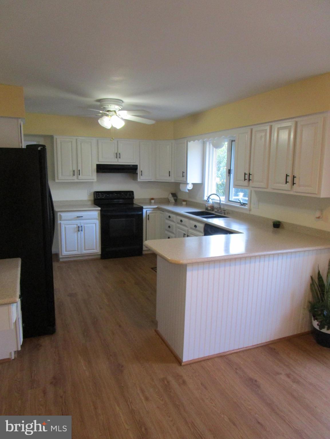 8505 Edenton Road Fulton, MD 20759 - Photo 21 of 38 a kitchen with stainless steel appliances granite countertop a stove a sink dishwasher and a refrigerator