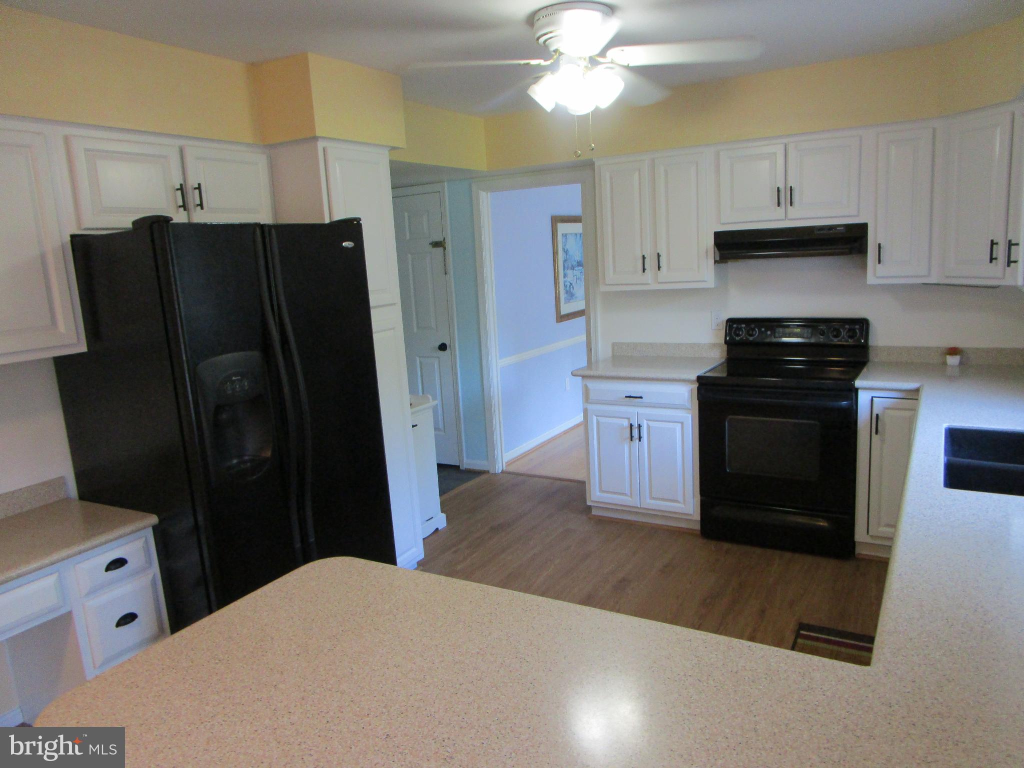 8505 Edenton Road Fulton, MD 20759 - Photo 22 of 38 a kitchen with a refrigerator and a sink