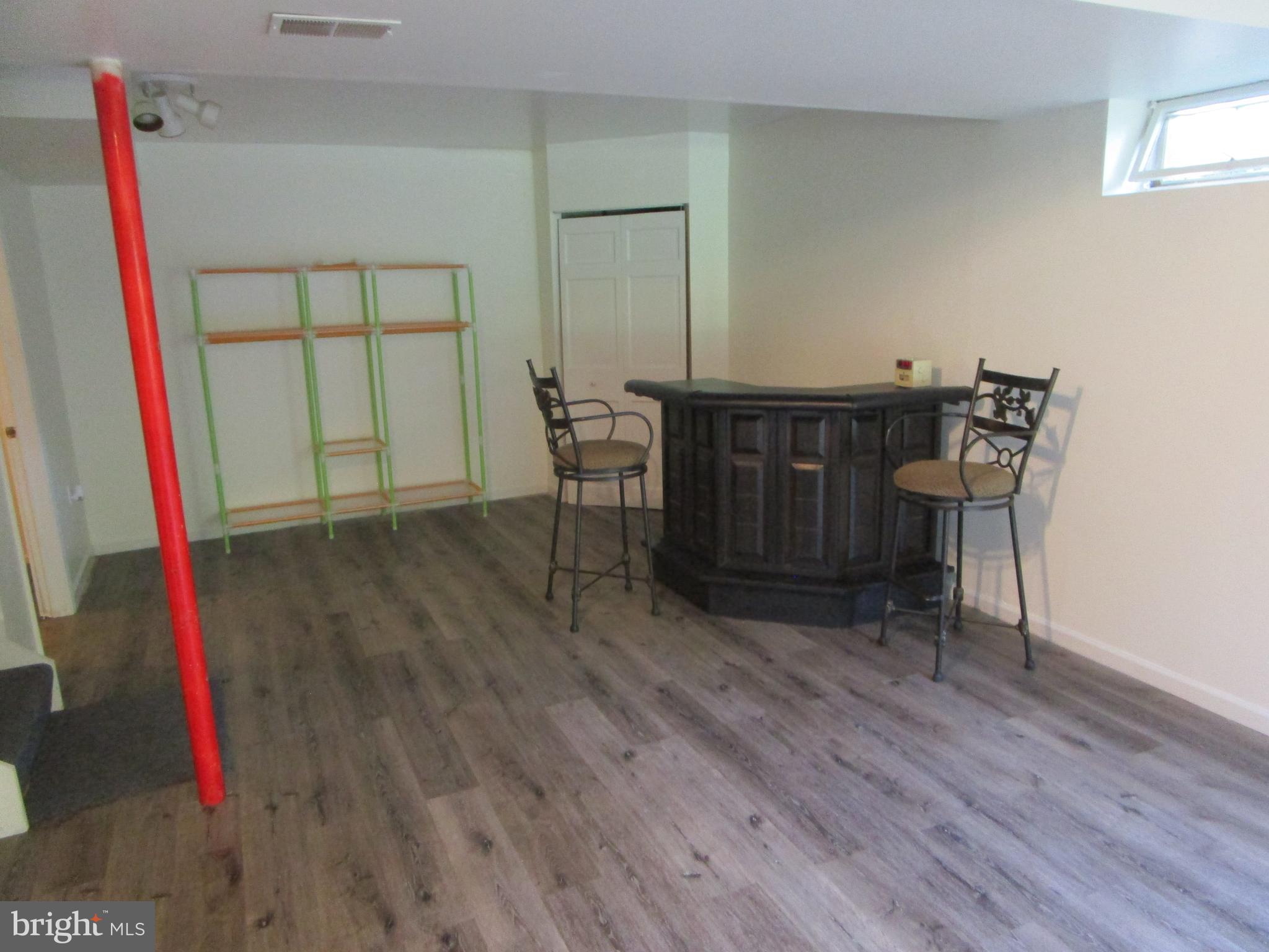 8505 Edenton Road Fulton, MD 20759 - Photo 35 of 38 a view of a room with furniture and wooden floor