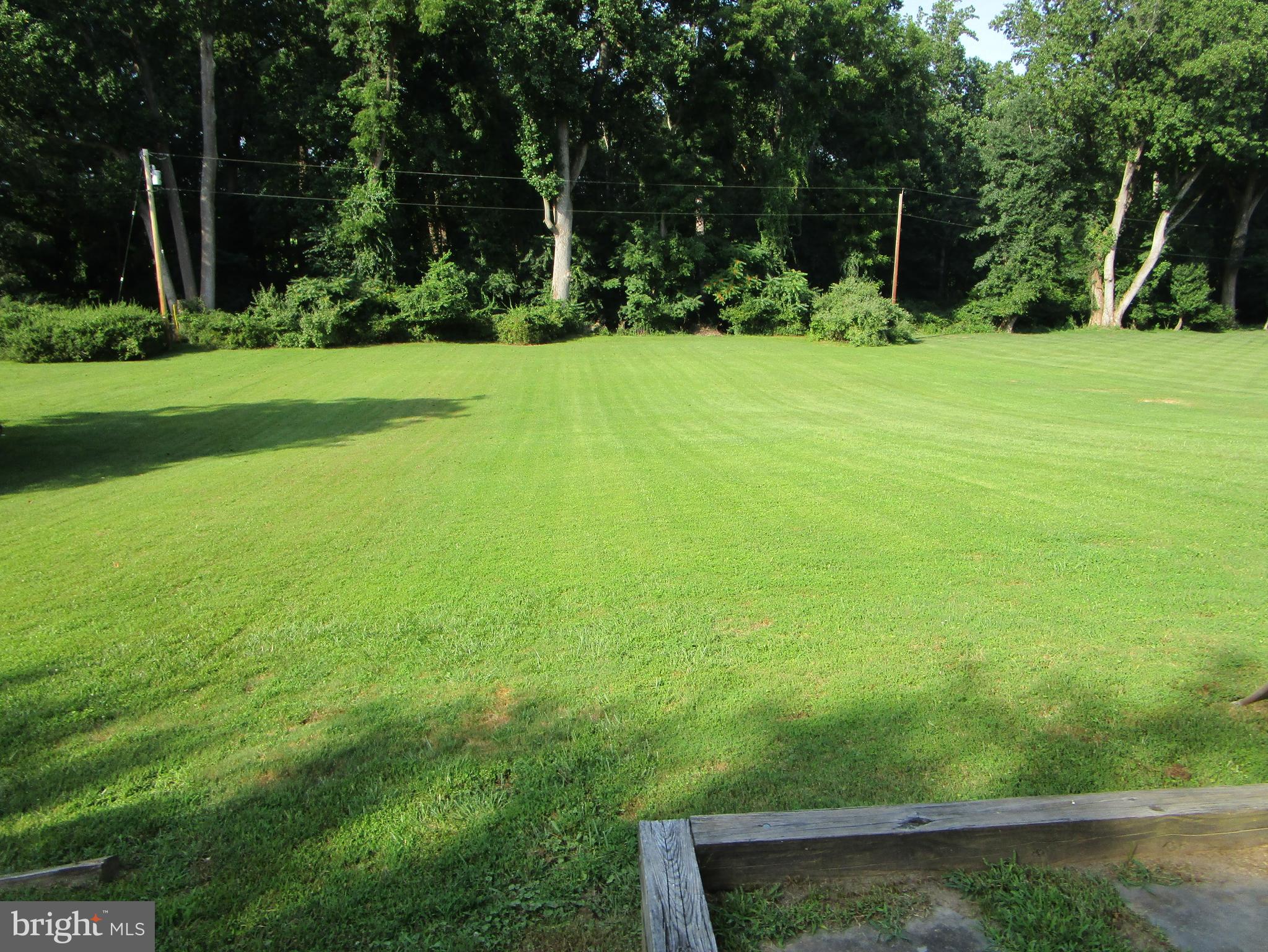8505 Edenton Road Fulton, MD 20759 - Photo 9 of 38 a view of a field with a trees in the background