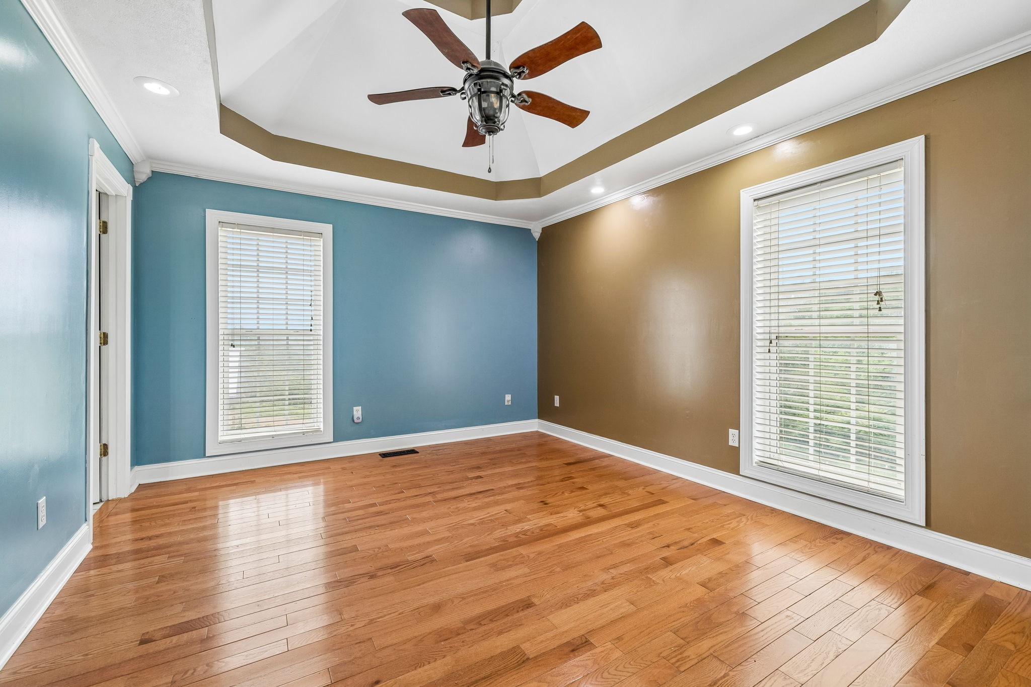 6701 McCormick Ridge Road Whitleyville, TN 38588 - Photo 27 of 63 an empty room with wooden floor and windows