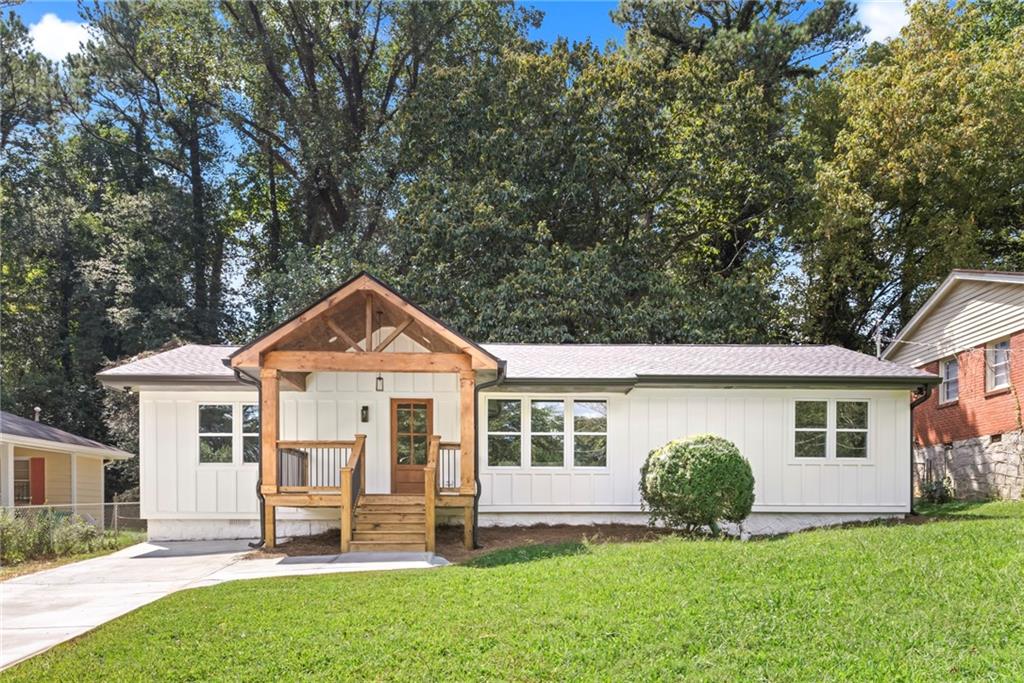 2053 Juanita Street Decatur, GA 30032 - Photo 1 of 1 a front view of a house with a yard