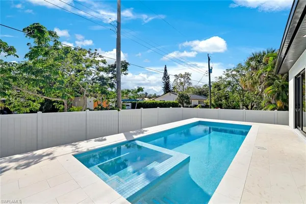 a view of a swimming pool with a patio