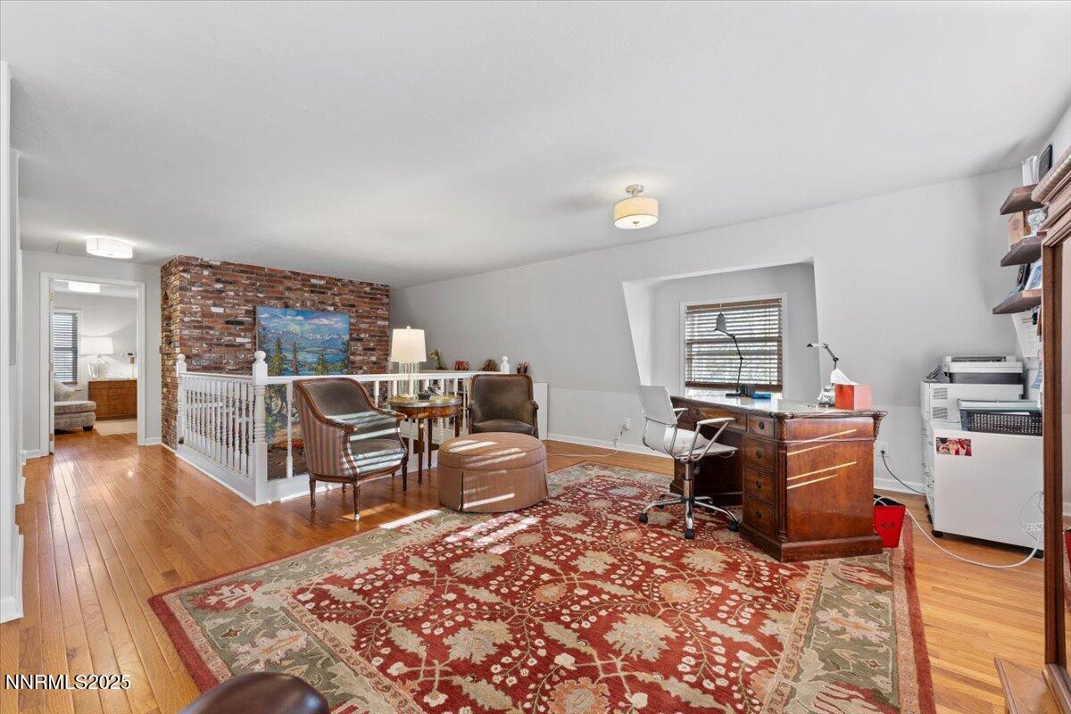 20855 Ames Lane Reno, NV 89521 - Photo 19 of 66 a living room with furniture and a dining table