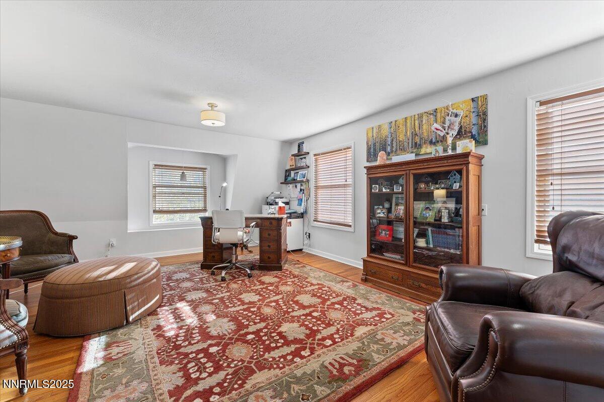 20855 Ames Lane Reno, NV 89521 - Photo 20 of 66 a living room with furniture and a wooden floor