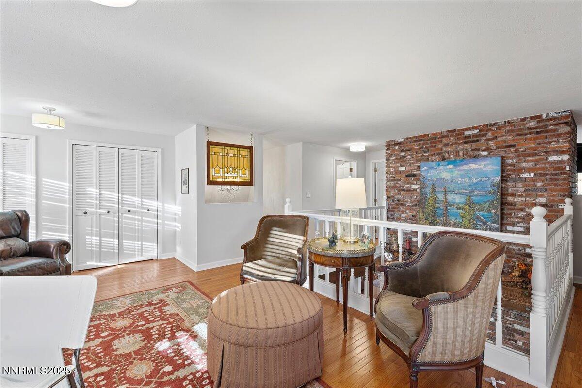 20855 Ames Lane Reno, NV 89521 - Photo 22 of 66 a living room with furniture and a floor to ceiling window