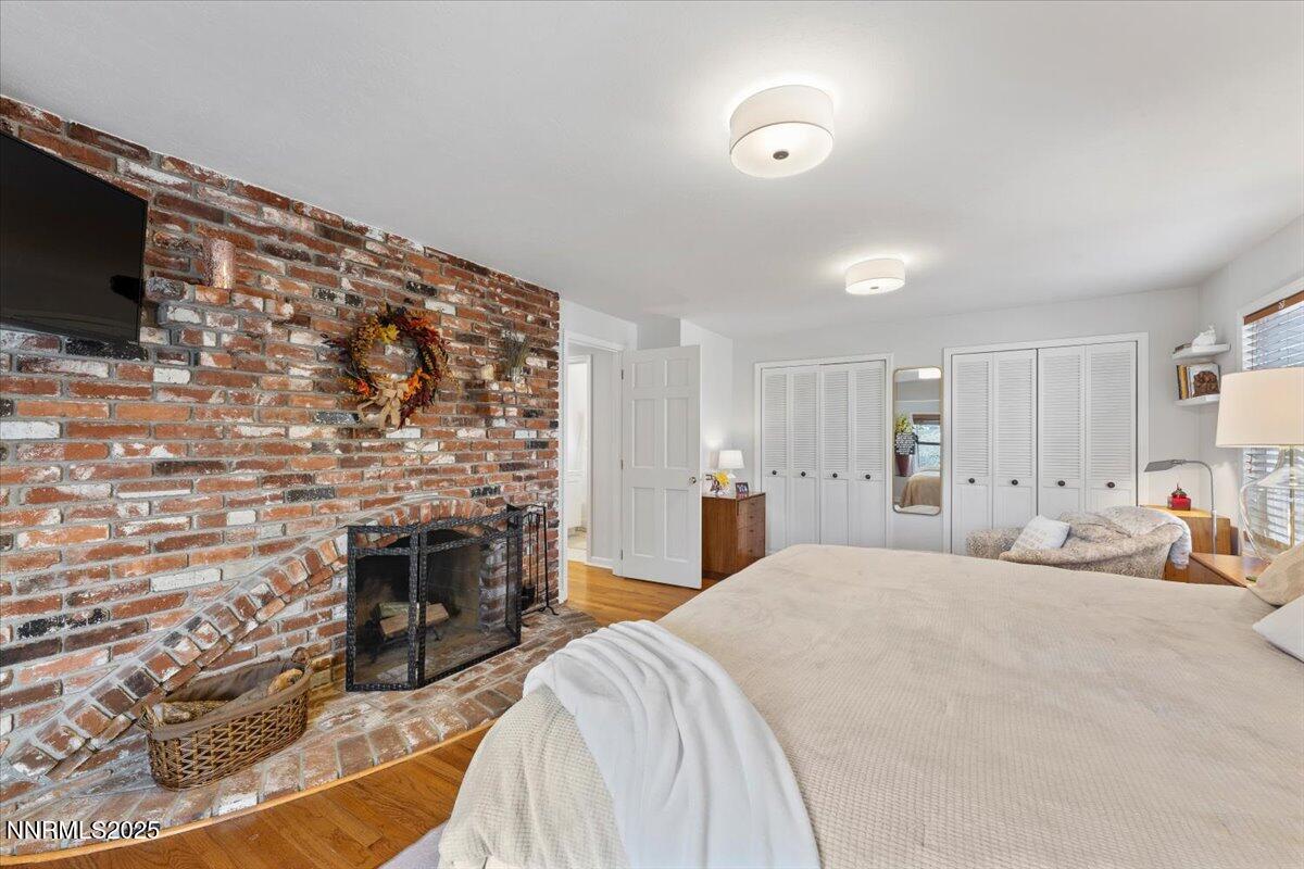 20855 Ames Lane Reno, NV 89521 - Photo 26 of 66 a bedroom with a bed and a flat screen tv