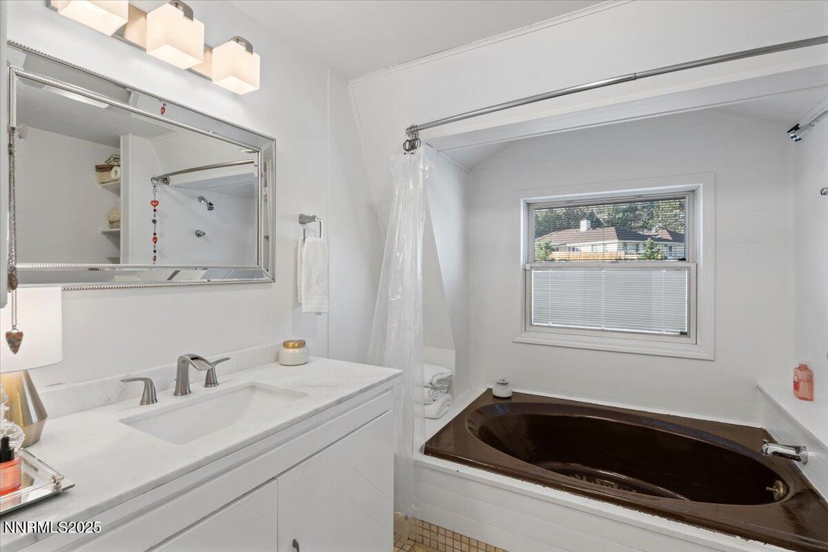 20855 Ames Lane Reno, NV 89521 - Photo 28 of 66 a bathroom with a sink and a bathtub