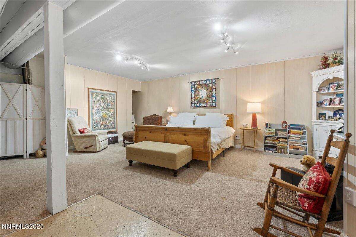 20855 Ames Lane Reno, NV 89521 - Photo 32 of 66 a bedroom with furniture and a couch