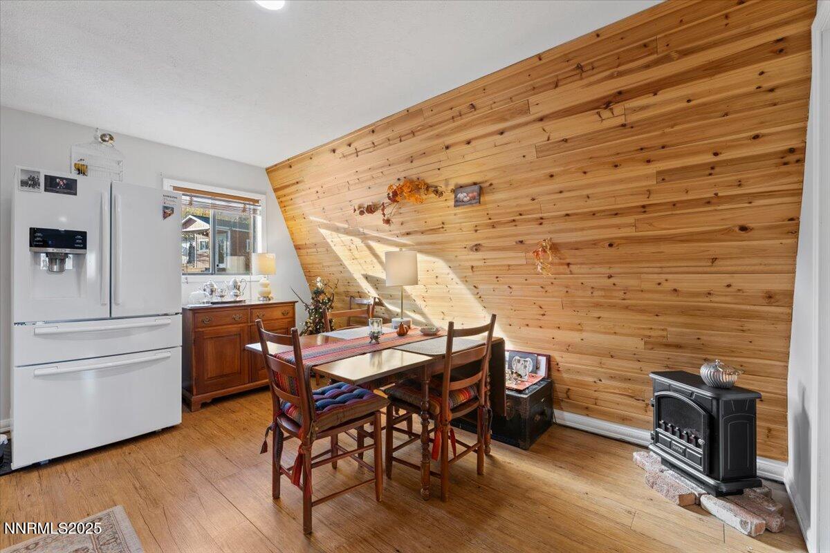 20855 Ames Lane Reno, NV 89521 - Photo 39 of 66 a view of a dining room with furniture and wooden floor