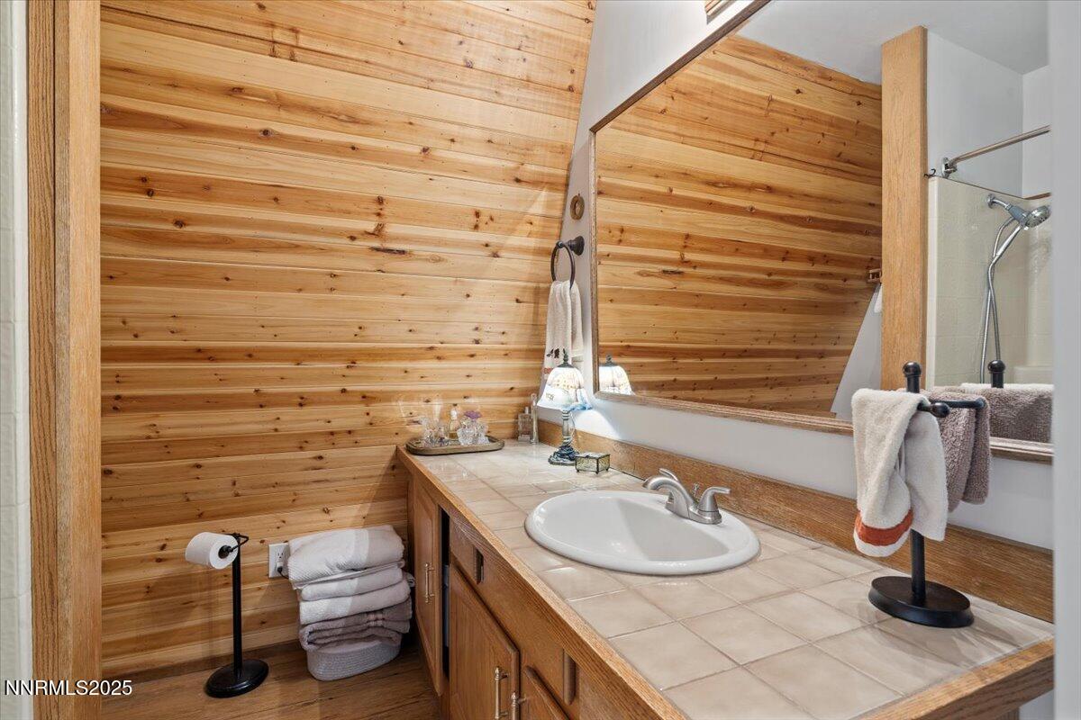 20855 Ames Lane Reno, NV 89521 - Photo 40 of 66 a bathroom with a sink and a mirror