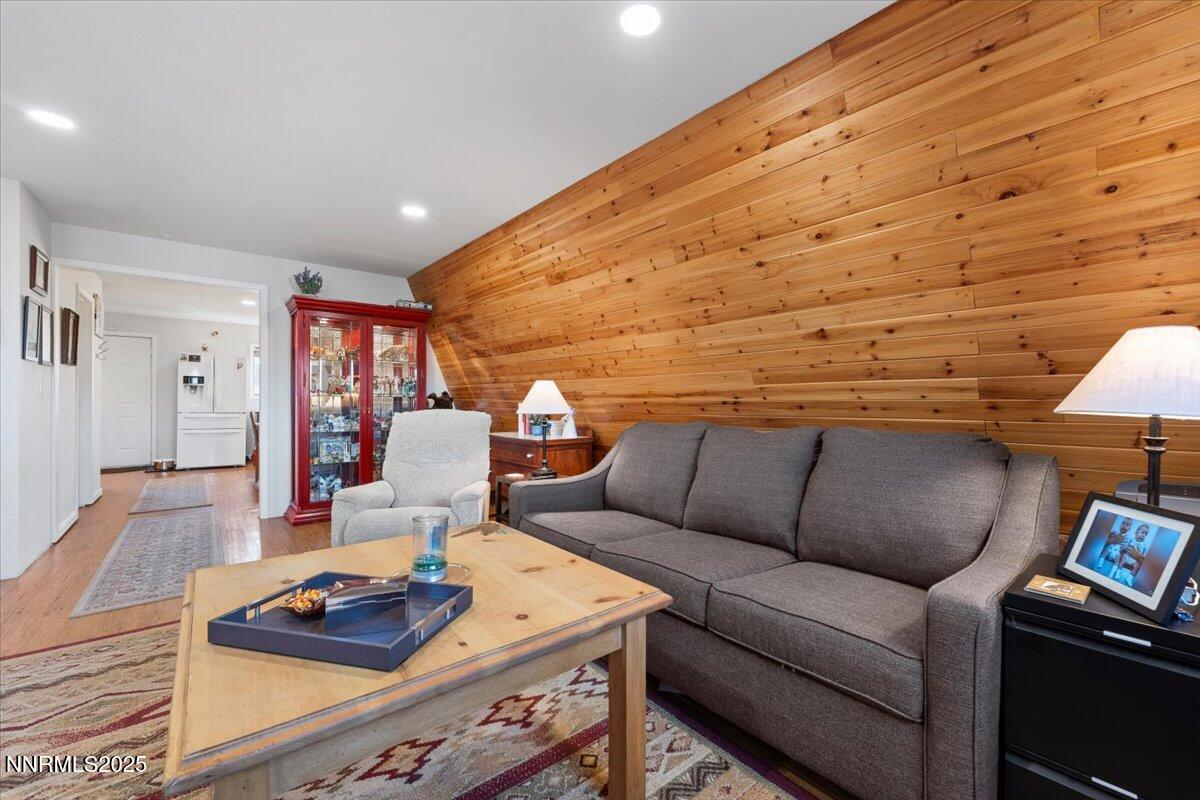 20855 Ames Lane Reno, NV 89521 - Photo 42 of 66 a living room with furniture and a wooden floor