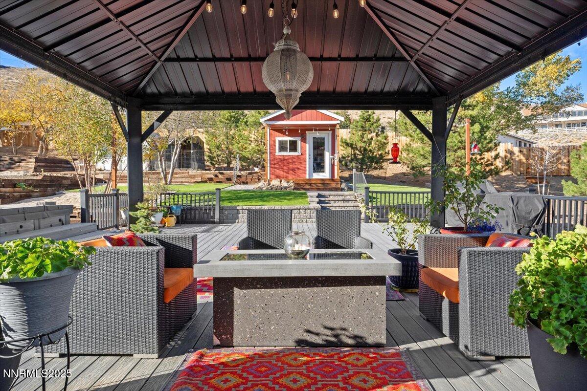 20855 Ames Lane Reno, NV 89521 - Photo 44 of 66 a view of a patio with a table chairs and a potted plant