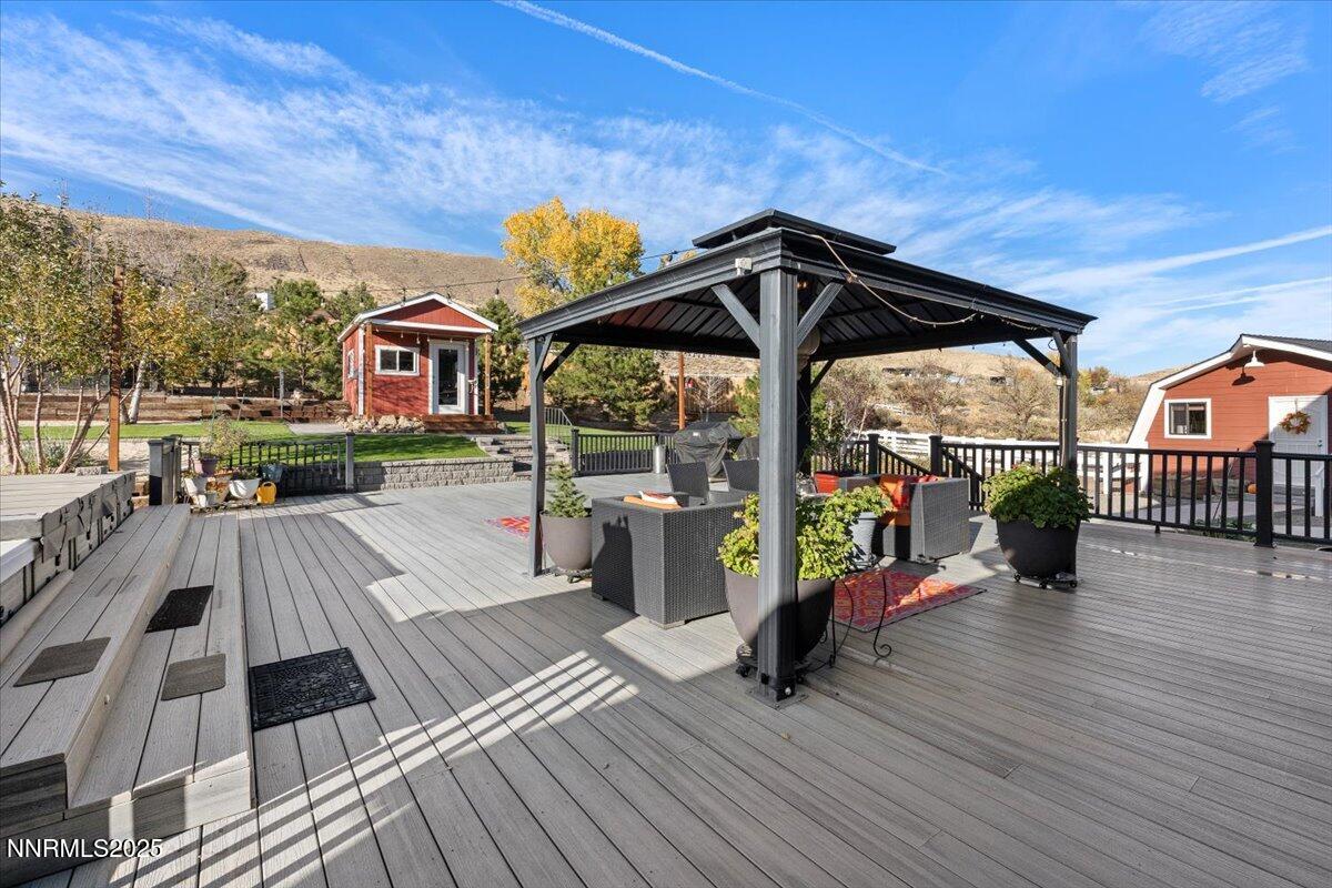 20855 Ames Lane Reno, NV 89521 - Photo 46 of 66 a view of balcony with deck and wooden floor